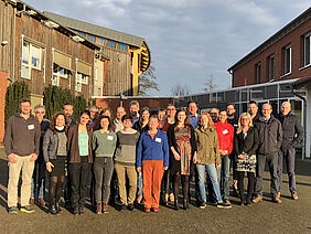 A group of people in front of a building