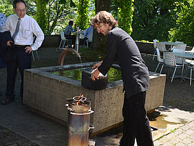 A man demonstrates tea brewing.