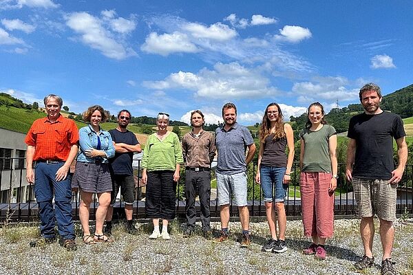 A group of people on a roof.