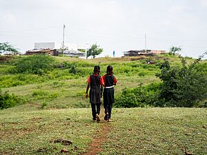 Anita Chouhan and her friend Rojni on a path