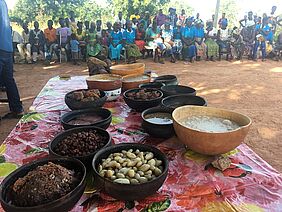 Food on a table with people in the background