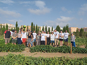 A group of people in a field.