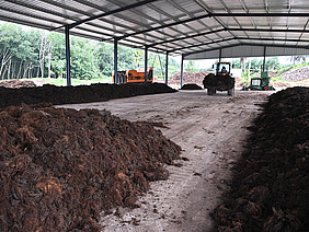 Compost protected by a roof.