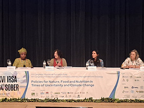 Four women at a panel.