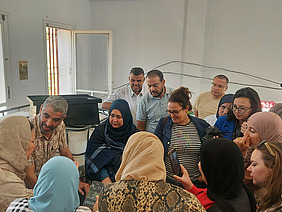 A group of people gathered in a room.