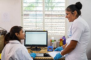 Monika Madhusudan Kanungo with a person at a computer