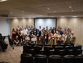 A group of people in a conference room