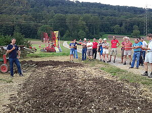 A group of people in arable land after tillage