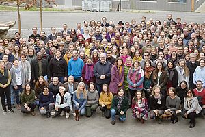  Team photo in front of the building Alvarium