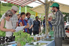 Matthias Klaiss is talking to visitors at his stand.