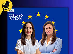 Two women in front of EU stars. 