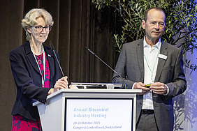 Two people at a podium.