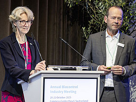 Two people at a podium.