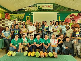 A group of about 30 people posing for a photo.
