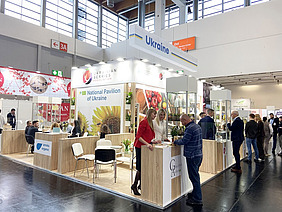 People attending a stand.