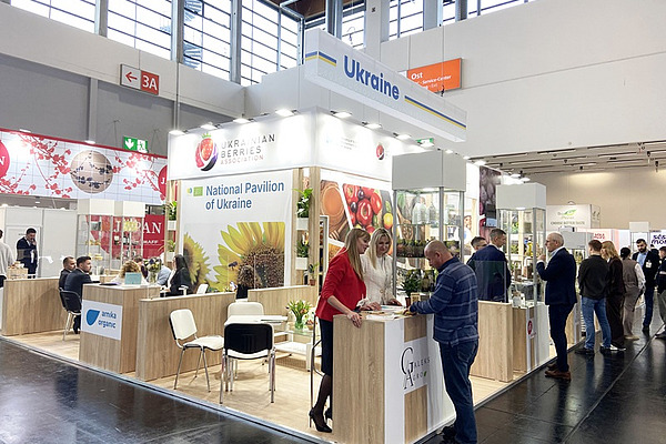 People attending a stand.